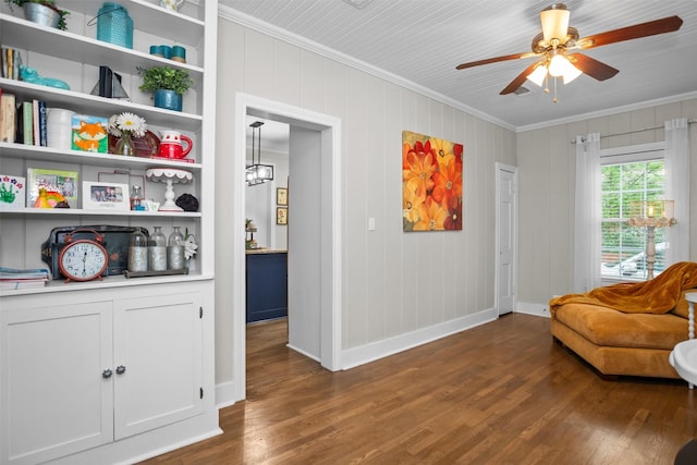 419 E Bell Ave, Crockett, TX 75835 - living area with baseboards, ornamental molding, ceiling fan, and dark wood-type flooring