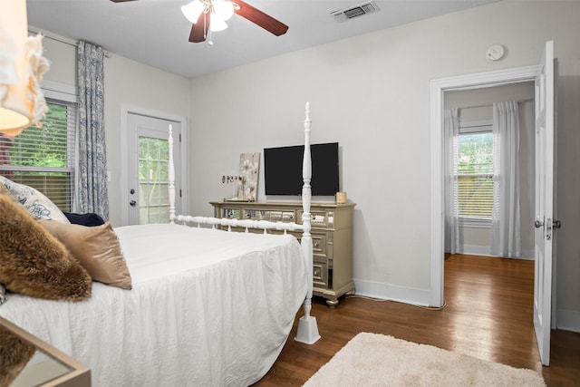 419 E Bell Ave, Crockett, TX 75835 - bedroom featuring multiple windows, visible vents, baseboards, and dark wood-type flooring