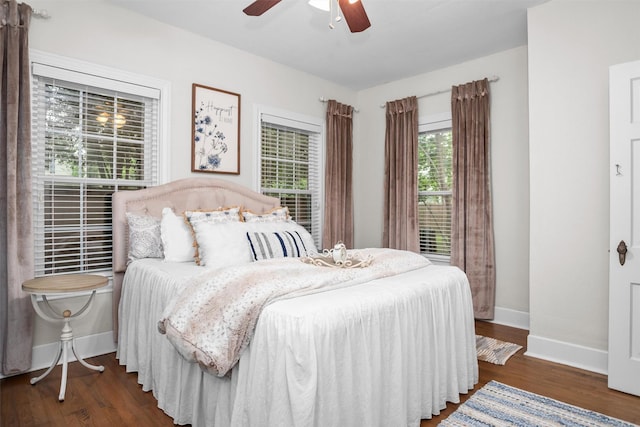 419 E Bell Ave, Crockett, TX 75835 - bedroom with wood finished floors, baseboards, and ceiling fan