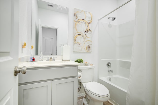 bathroom with vanity, shower / bathtub combination with curtain, visible vents, and toilet