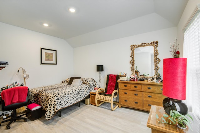 bedroom featuring lofted ceiling, recessed lighting, and wood finished floors