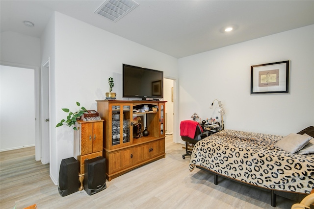 bedroom featuring baseboards, recessed lighting, visible vents, and wood finished floors