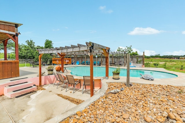 view of swimming pool with a fenced backyard, a pergola, and a fenced in pool