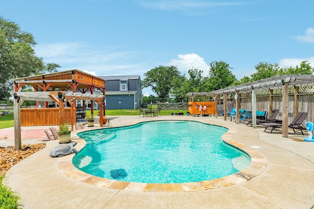 view of swimming pool with a patio area, a pergola, a fenced in pool, and fence