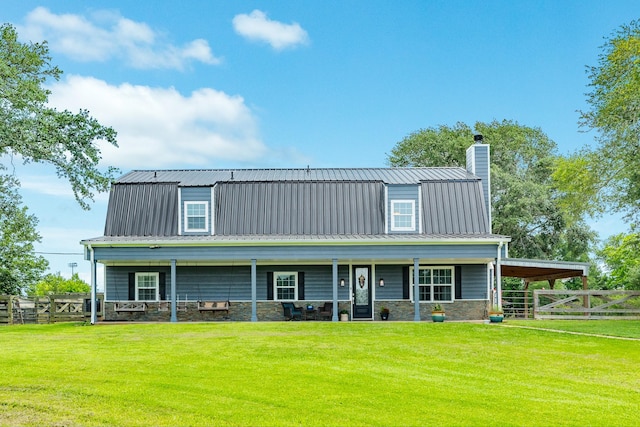 view of front of property featuring metal roof, fence, a front lawn, and a chimney
