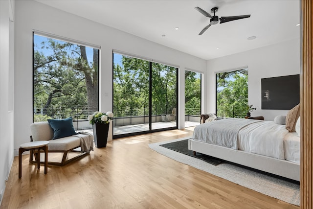 1900 W 14th St, Houston, TX 77008 - bedroom featuring multiple windows, wood finished floors, recessed lighting, and access to exterior