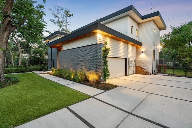 1900 W 14th St, Houston, TX 77008 - view of property exterior with a yard, driveway, fence, and a gate