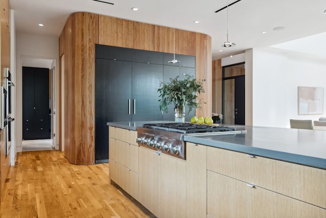 1900 W 14th St, Houston, TX 77008 - kitchen featuring light wood-type flooring, modern cabinets, pendant lighting, and stainless steel gas cooktop