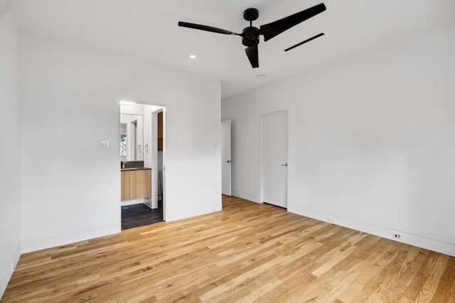 1900 W 14th St, Houston, TX 77008 - unfurnished bedroom featuring recessed lighting, ensuite bath, visible vents, and wood finished floors