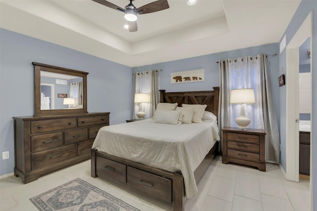 bedroom with light tile patterned floors, a tray ceiling, baseboards, ceiling fan, and recessed lighting