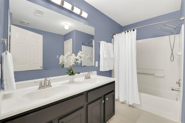 bathroom with a sink, double vanity, shower / bath combo with shower curtain, and visible vents