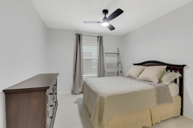 bedroom with baseboards and ceiling fan