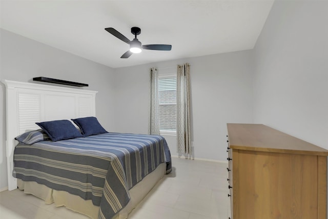 bedroom featuring light floors, baseboards, and ceiling fan