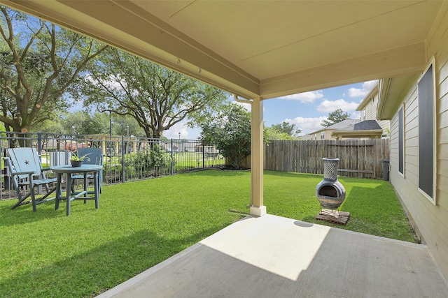 view of yard featuring a patio and a fenced backyard