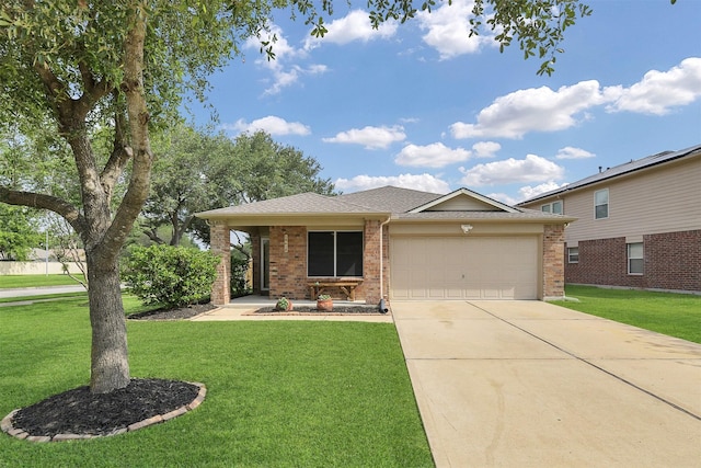 ranch-style home with a garage, a front lawn, brick siding, and driveway