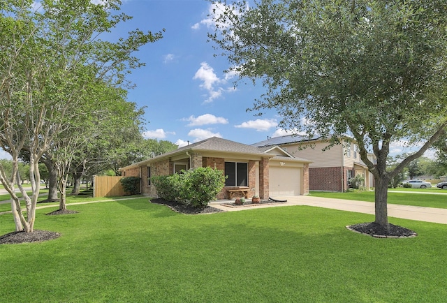 ranch-style house featuring brick siding, concrete driveway, a garage, a front lawn, and solar panels