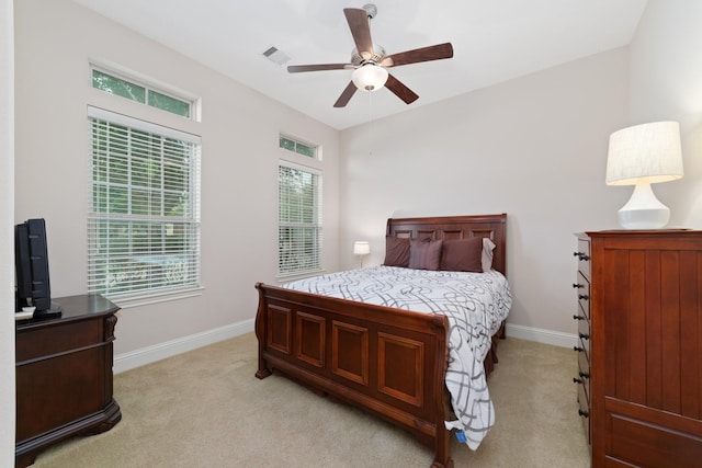 17803 Netherby Ln, Richmond, TX 77407 - bedroom featuring light colored carpet, multiple windows, and a ceiling fan