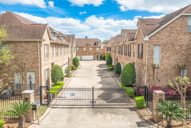 2827 Briarhurst Park, Houston, TX 77057 - view of road with a residential view, a gated entry, and a gate