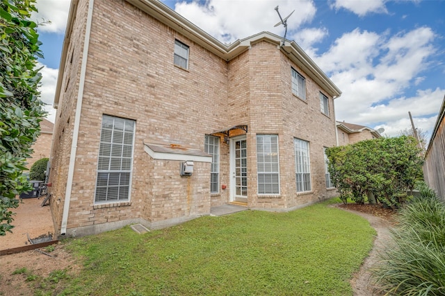 2827 Briarhurst Park, Houston, TX 77057 - rear view of property featuring a yard and brick siding