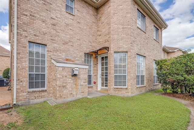 2827 Briarhurst Park, Houston, TX 77057 - exterior space featuring a lawn, central AC, and brick siding