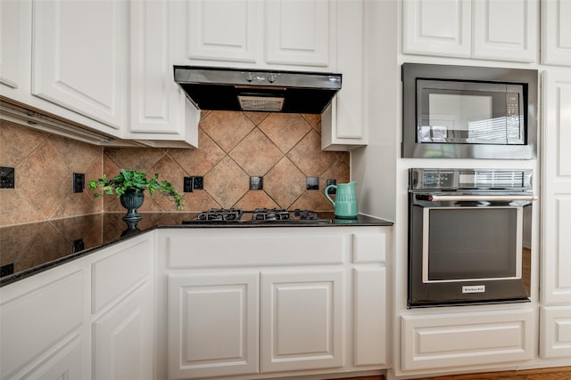 2827 Briarhurst Park, Houston, TX 77057 - kitchen featuring built in microwave, under cabinet range hood, stainless steel oven, white cabinets, and black gas stovetop