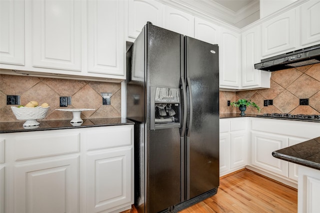 2827 Briarhurst Park, Houston, TX 77057 - kitchen with white cabinetry, gas stovetop, and black refrigerator with ice dispenser