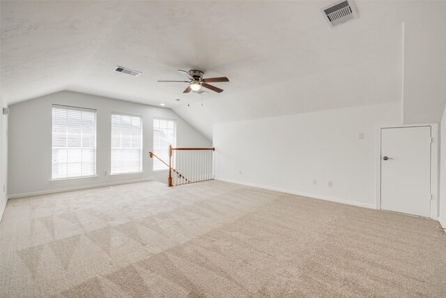 2827 Briarhurst Park, Houston, TX 77057 - additional living space featuring vaulted ceiling, light carpet, a ceiling fan, and visible vents