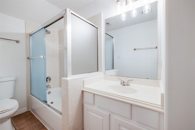2827 Briarhurst Park, Houston, TX 77057 - full bathroom featuring vanity, toilet, and shower / bath combination with glass door