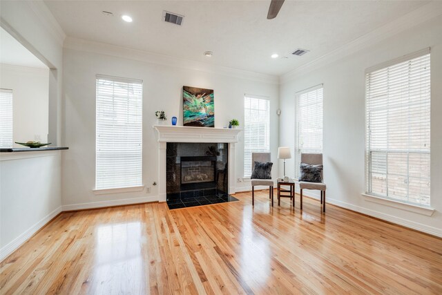 2827 Briarhurst Park, Houston, TX 77057 - living room featuring ornamental molding, visible vents, and wood finished floors