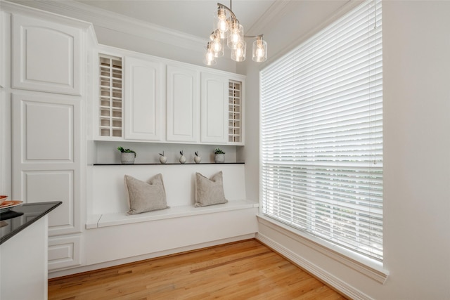 2827 Briarhurst Park, Houston, TX 77057 - interior space featuring crown molding, an inviting chandelier, and light wood-style floors