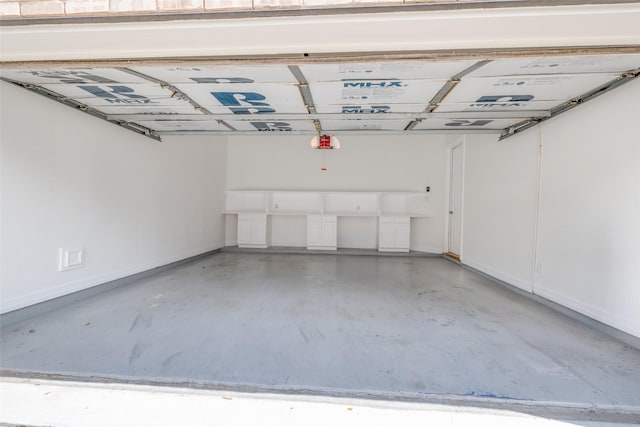 2827 Briarhurst Park, Houston, TX 77057 - garage featuring baseboards and a garage door opener