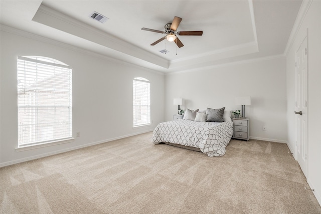 2827 Briarhurst Park, Houston, TX 77057 - bedroom with ornamental molding, visible vents, light carpet, a tray ceiling, and baseboards