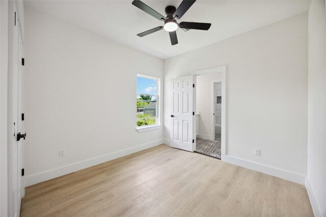 3212 Retta St, Houston, TX 77026 - unfurnished bedroom featuring ceiling fan, baseboards, and wood finished floors