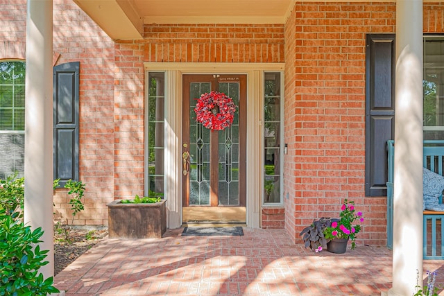 property entrance with brick siding