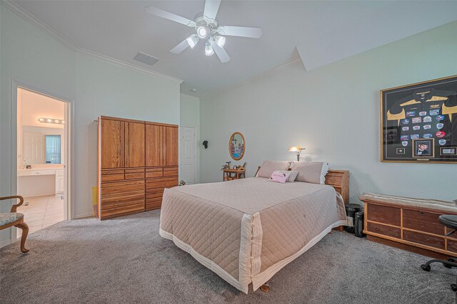 bedroom with carpet, crown molding, ensuite bath, and ceiling fan