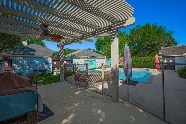 view of pool with a pergola, ceiling fan, a fenced backyard, and a patio