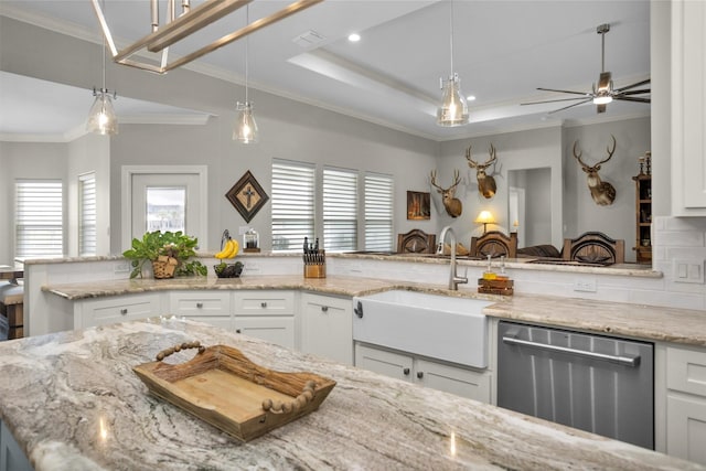 kitchen with stainless steel dishwasher, tasteful backsplash, ornamental molding, and a sink