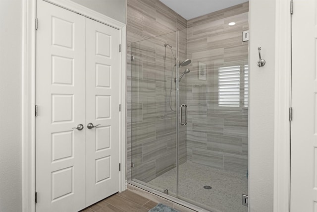 bathroom with a shower stall