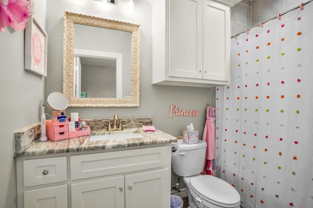 full bath featuring toilet, a shower with shower curtain, and vanity