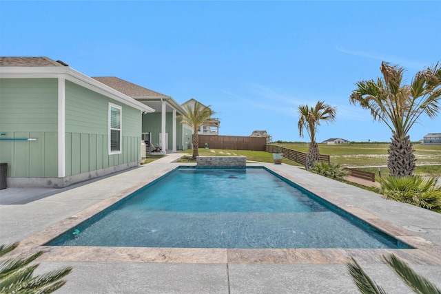 outdoor pool featuring a fenced backyard