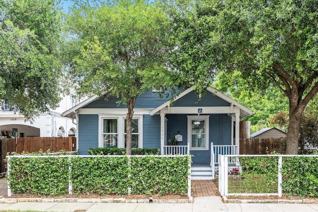 1206 Northwood St, Houston, TX 77009 - bungalow-style home featuring covered porch and a fenced front yard