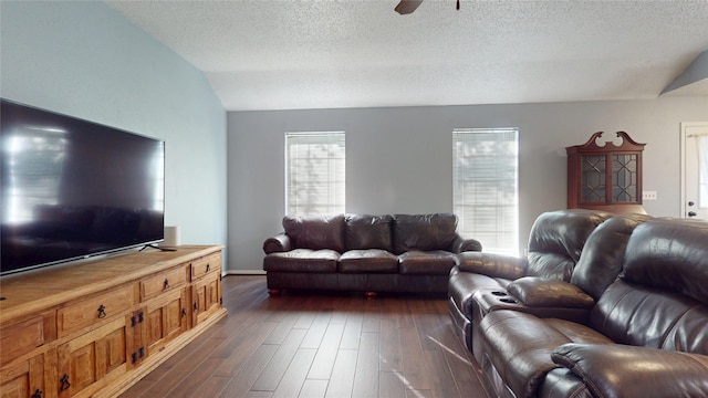 9310 Palm Shores Dr, Spring, TX 77379 - living area featuring a ceiling fan, dark wood-style floors, a textured ceiling, and vaulted ceiling