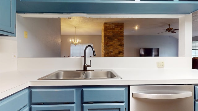 kitchen featuring stainless steel dishwasher, blue cabinets, a sink, ceiling fan with notable chandelier, and light countertops