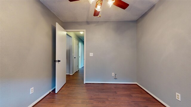 9310 Palm Shores Dr, Spring, TX 77379 - spare room featuring a textured ceiling, baseboards, wood finished floors, and a ceiling fan