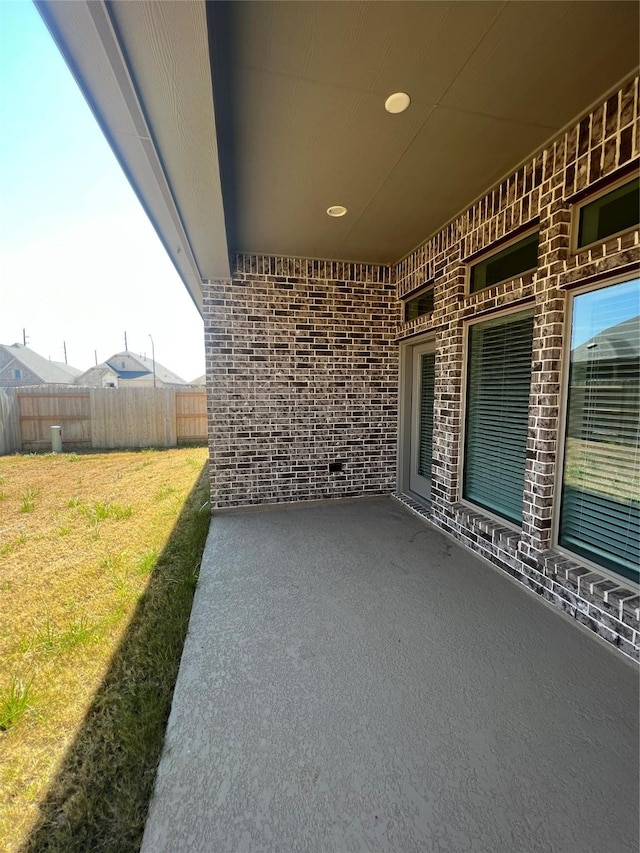 view of patio featuring fence