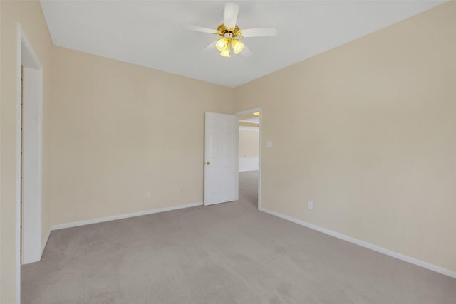 14906 Stonemeade Pl, Cypress, TX 77429 - spare room featuring light carpet, baseboards, and a ceiling fan