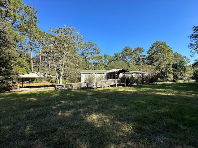 view of yard featuring a wooden deck