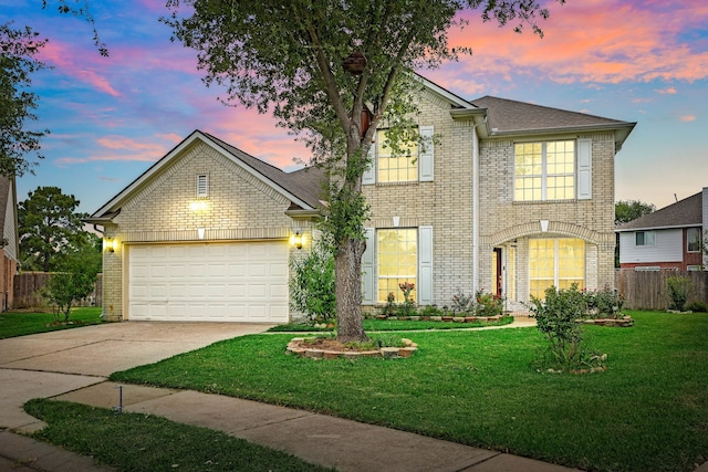 traditional home with brick siding, concrete driveway, and a garage