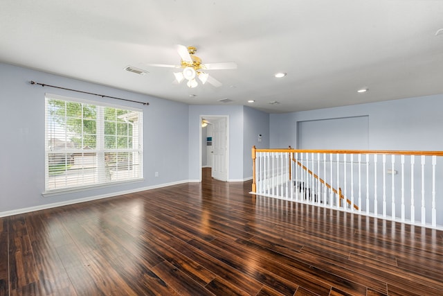 unfurnished room featuring ceiling fan, wood finished floors, baseboards, and recessed lighting