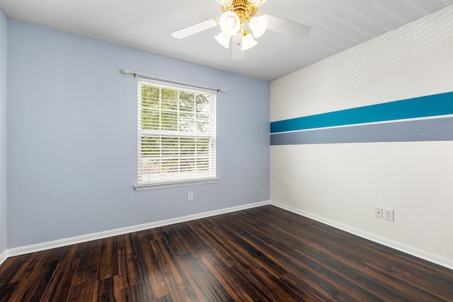 empty room with baseboards, wood finished floors, and a ceiling fan